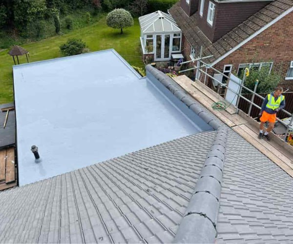 This is a photo of a newly installed hip roof, with a combined liquid covered flat roof. Work carried out by SC Roofing Olney