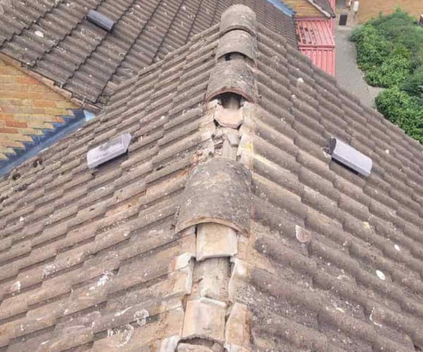 This is a photo if a roof ridge which has missing tiles. The ridge tiles are being replaced by SC Roofing Olney